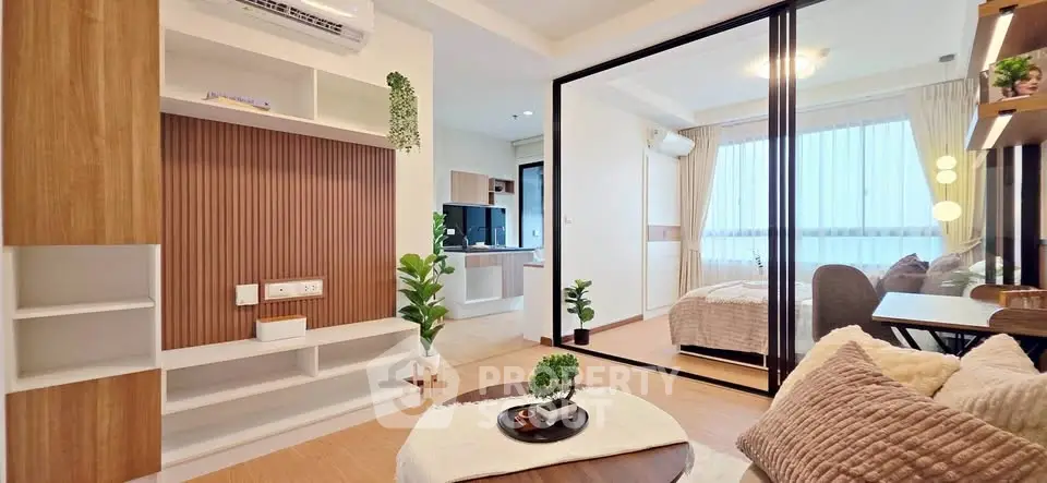 Modern living room with open layout and cozy bedroom view