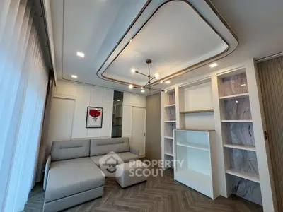 Modern living room with stylish lighting and built-in shelving