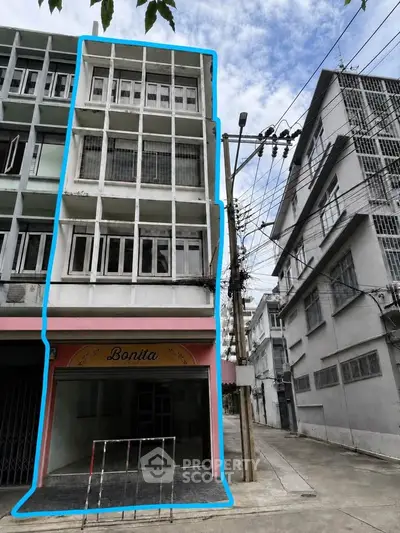 Charming multi-story building with potential for commercial and residential use in urban setting.