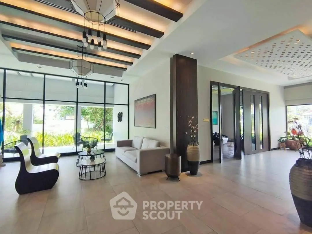 Luxurious modern lobby with stylish seating and large windows offering garden views.