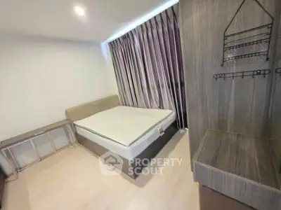 Modern bedroom with stylish furniture and large window with curtains