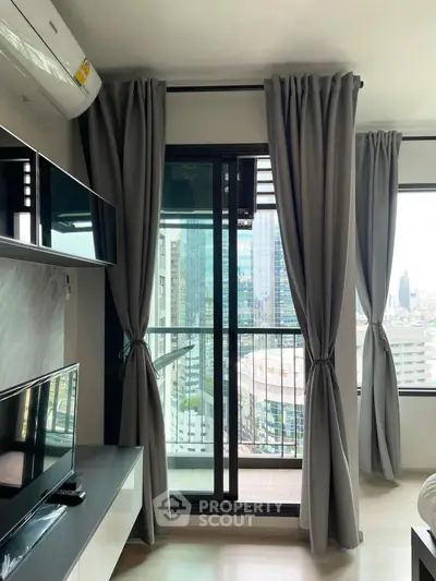 Modern living room with balcony view in high-rise apartment
