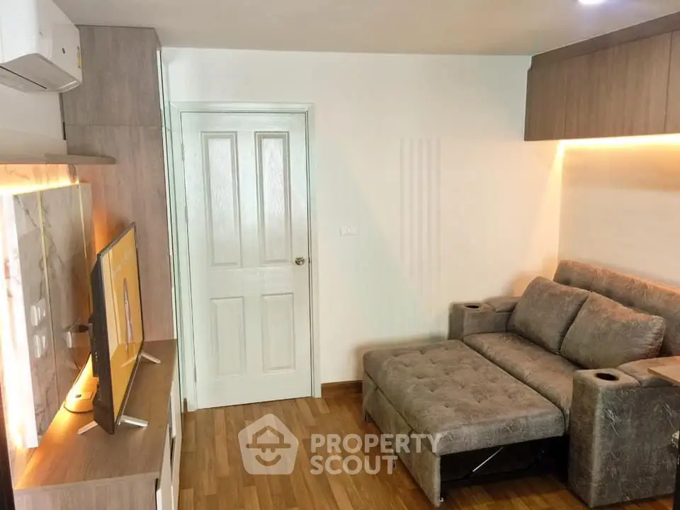 Cozy living room with modern sofa bed and sleek TV setup