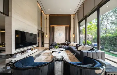 Luxurious modern living room with large windows and elegant decor