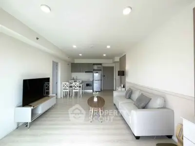 Spacious modern living room with open kitchen and stylish decor