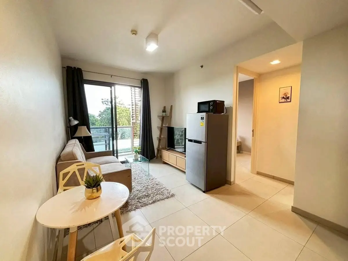 Modern living room with balcony and stylish furniture in a cozy apartment