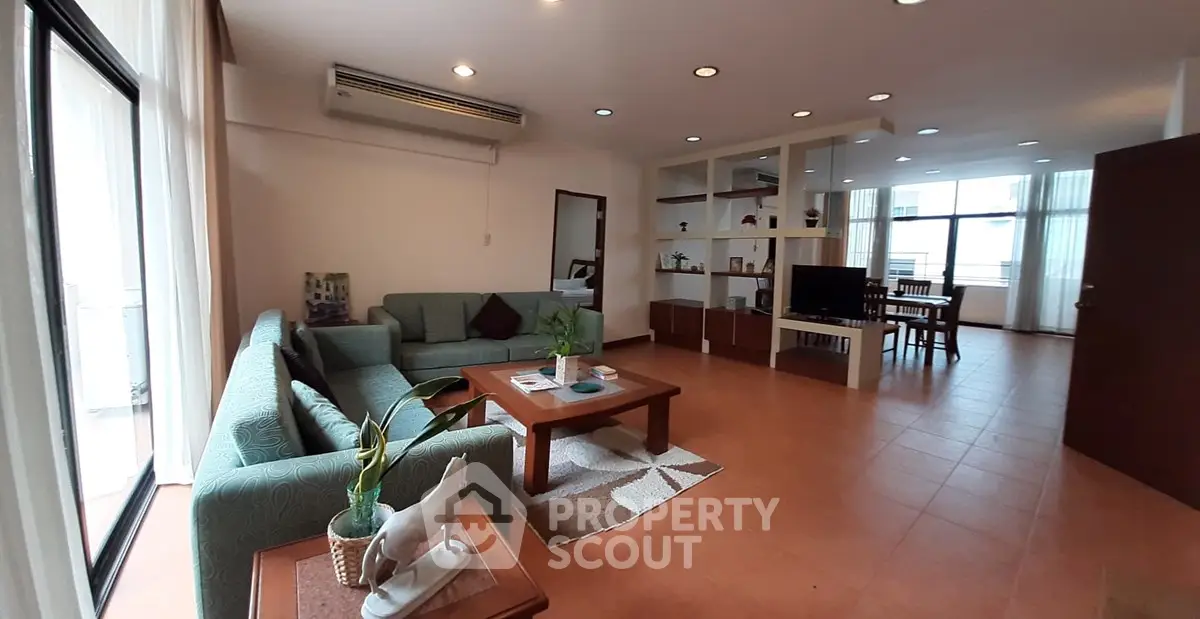 Spacious living room with modern decor and open layout, perfect for relaxation and entertainment.