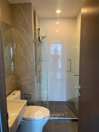 Modern bathroom with sleek shower and elegant tile design