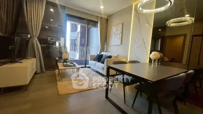 Modern living room with elegant decor and open kitchen layout