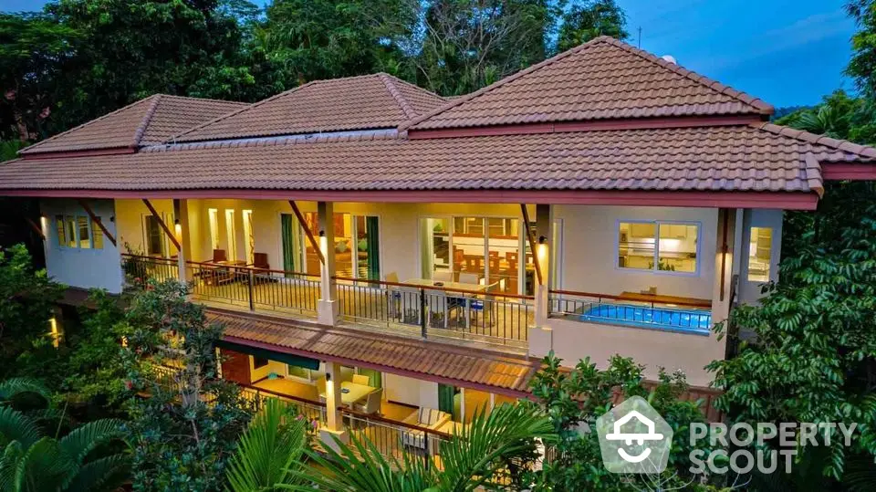 Luxurious tropical villa with pool and lush greenery, perfect for serene living.