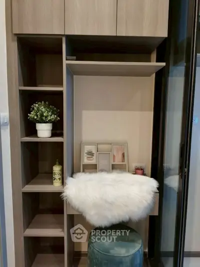 Stylish modern study nook with plush seating and decorative shelving