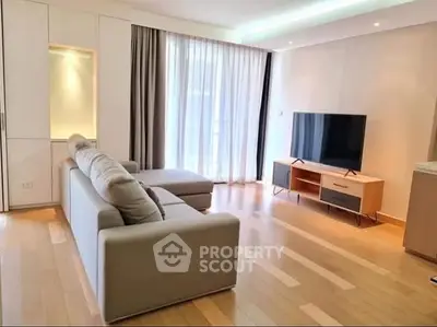 Spacious modern living room with sleek furniture and natural light