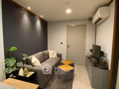 Cozy modern living room with stylish decor and air conditioning