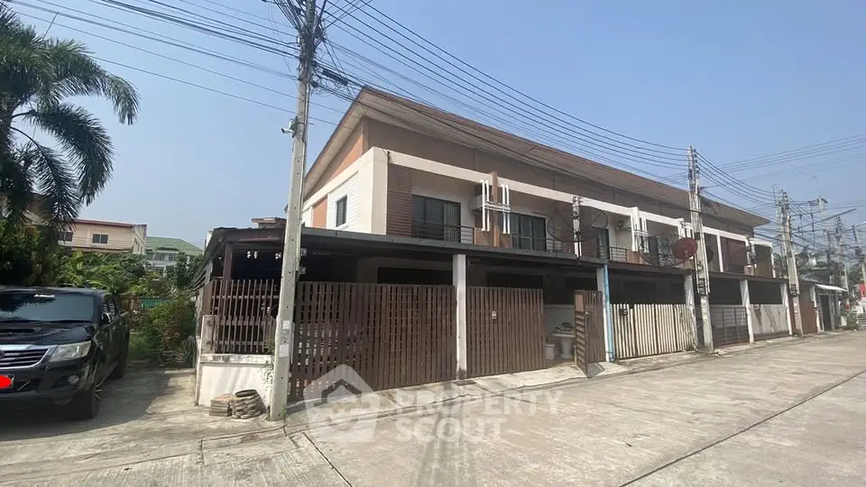 Charming townhouse with modern facade in a serene neighborhood, perfect for family living.