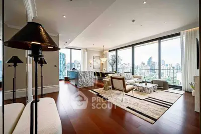 Luxurious open-plan living room with stunning city view and modern decor