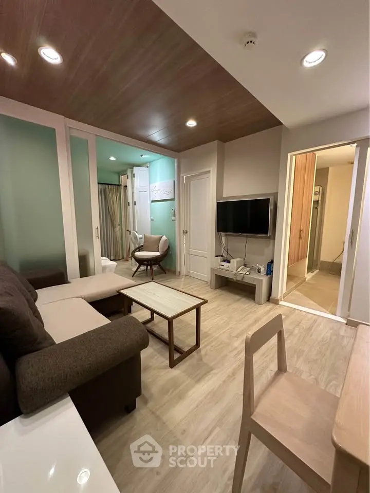 Modern living room with stylish furniture and open layout, perfect for cozy gatherings.