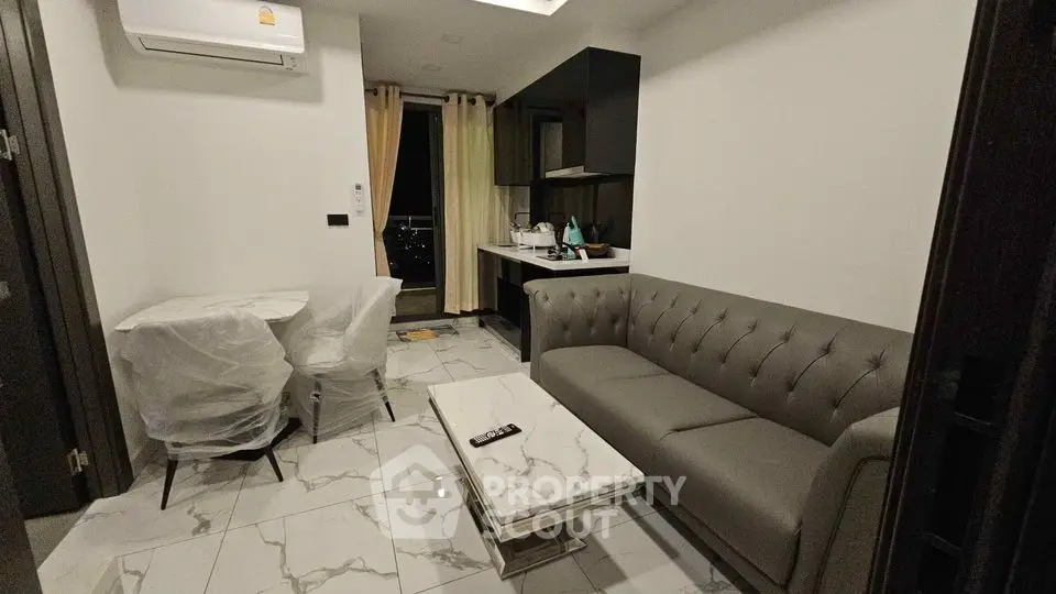 Modern living room with sleek sofa and marble table in stylish apartment
