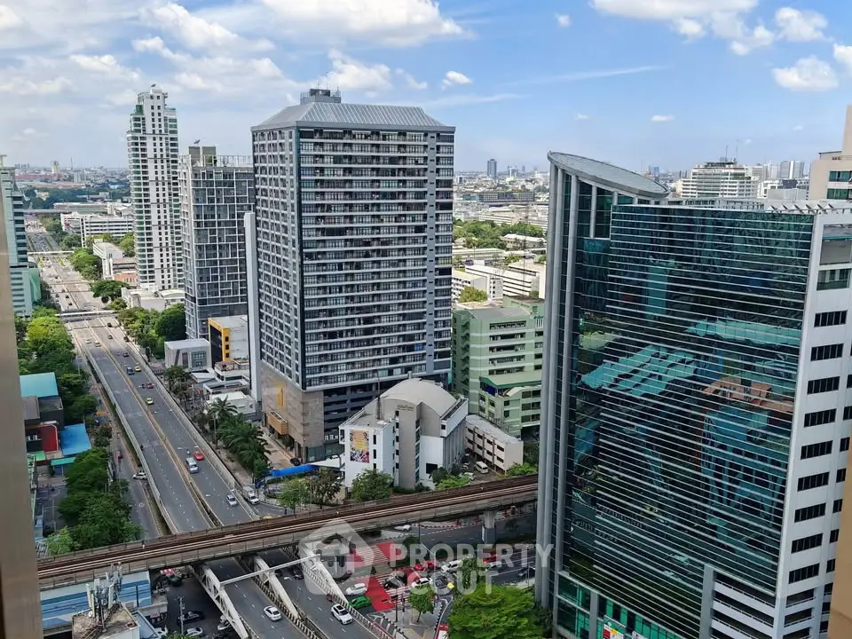 Stunning cityscape view showcasing modern high-rise buildings and bustling urban streets.