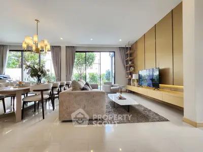 Luxurious open-plan living room with elegant dining area and modern decor