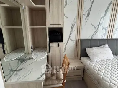 Modern bedroom with stylish marble accents and cozy wooden furniture