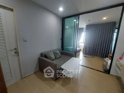 Modern apartment interior with cozy living area and bedroom view