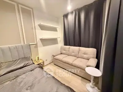 Cozy bedroom with elegant decor and comfortable seating area