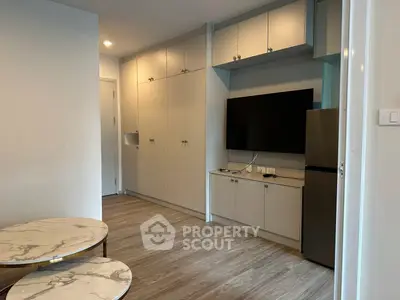 Modern living room with built-in storage and sleek TV setup