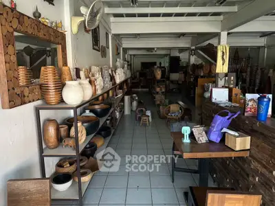 Charming interior showcasing rustic wooden decor and pottery in a cozy shop setting.