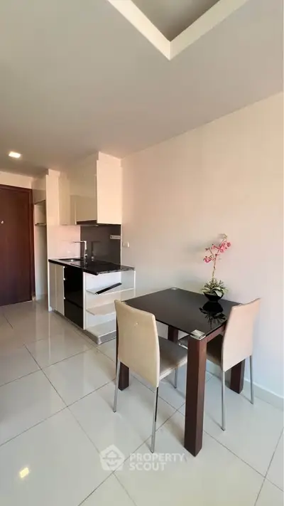 Modern kitchen and dining area with sleek design and elegant decor.