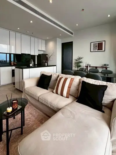 Modern living room with open kitchen and stylish decor