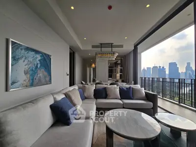 Luxurious living room with modern decor and stunning city view from spacious balcony.