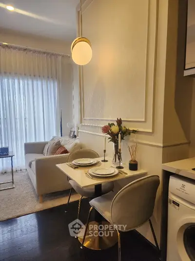 Modern living room with elegant dining setup and washing machine