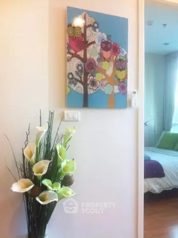 Charming bedroom with colorful owl artwork and elegant floral decor