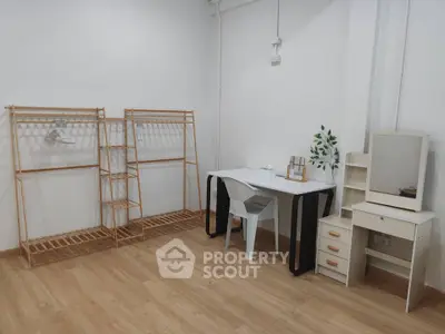 Modern minimalist study room with wooden flooring and stylish furniture