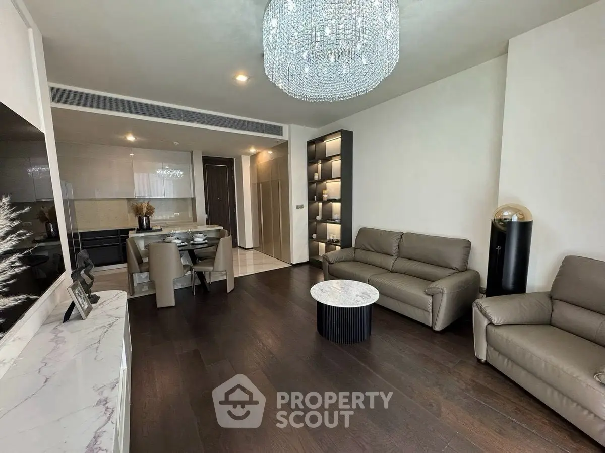 Luxurious living room with elegant chandelier and modern furniture