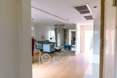 Spacious living room with modern decor and natural light