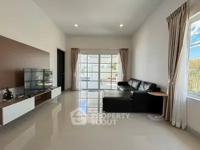 Spacious modern living room with sleek design and abundant natural light