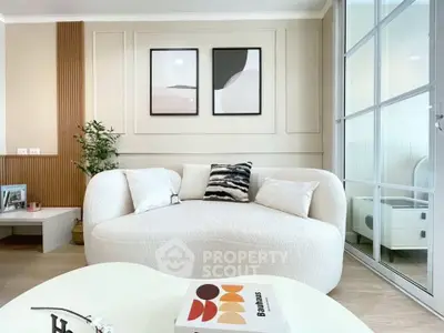 Stylish modern living room with cozy white sofa and chic decor