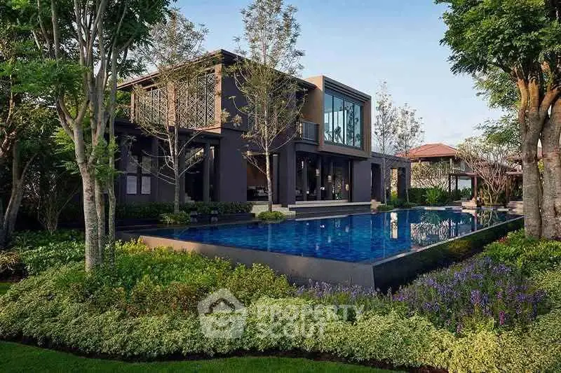 Luxurious modern villa with stunning pool and lush garden landscape