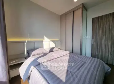 Modern bedroom with stylish decor and ample natural light