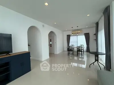 Spacious modern living room with dining area and elegant decor