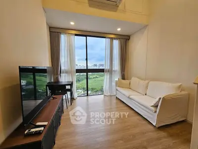 Spacious living room with stunning city view and modern furnishings