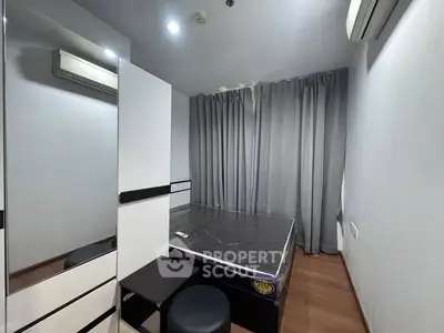 Cozy modern bedroom with air conditioning and stylish decor