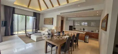 Spacious modern living room with open kitchen and elegant dining area