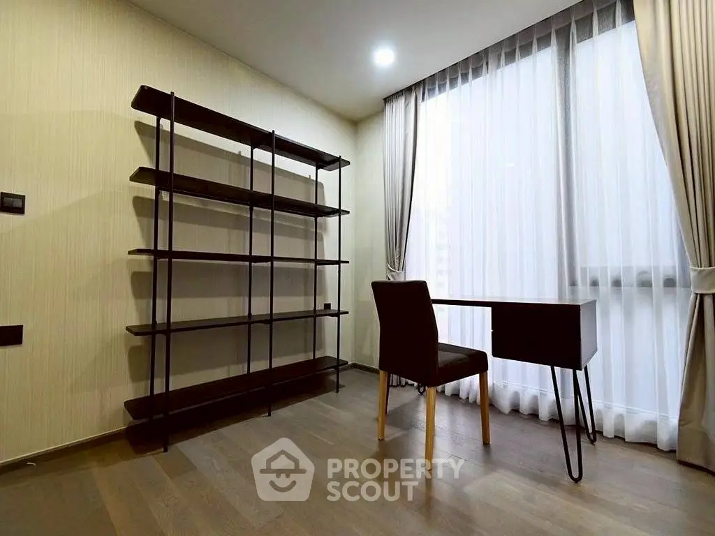 Modern study room with sleek desk and shelving, featuring floor-to-ceiling windows and elegant curtains.