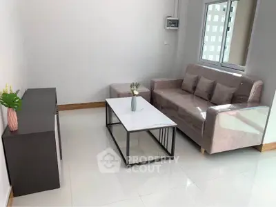 Modern living room with sleek furniture and natural light