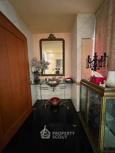 Elegant bathroom with vintage decor and large mirror