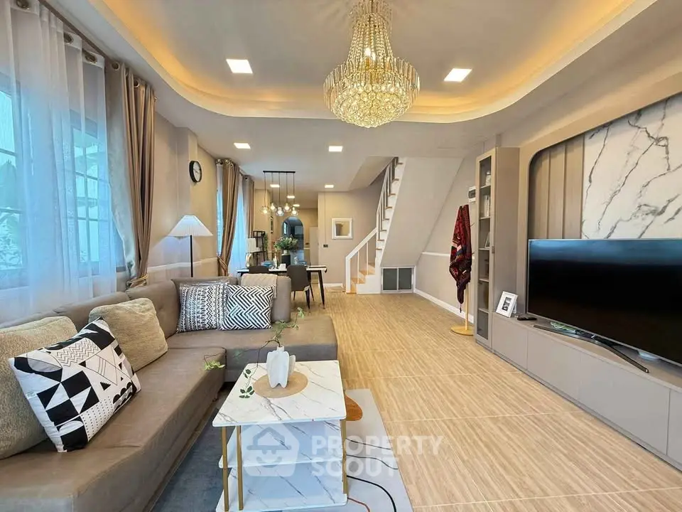 Luxurious living room with elegant chandelier and modern decor