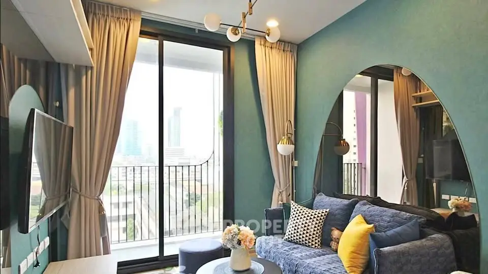 Stylish living room with modern decor and balcony view in urban apartment