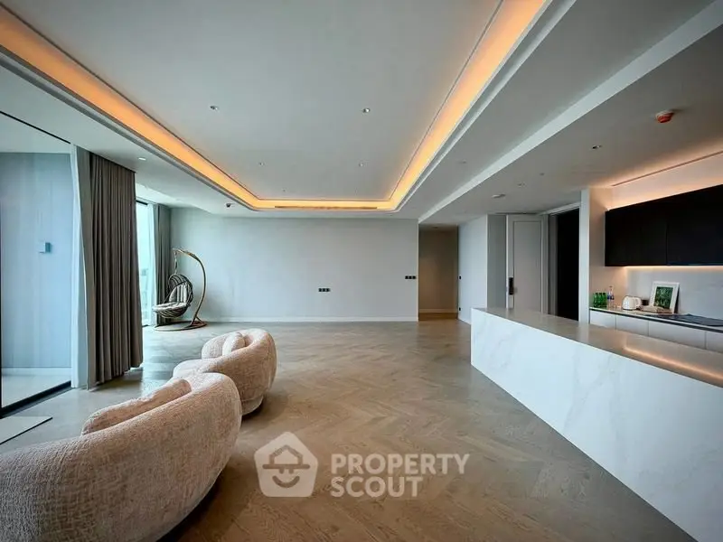 Spacious modern living room with elegant lighting and open layout